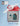 Cross-stitched snowman and house design on a box with a red ribbon, featuring 'Heart in Hand' branding.