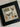 Framed cross-stitched artwork with Halloween-themed designs on a beige background.