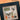 Halloween-themed cross-stitch pattern with decorative elements on a black frame.