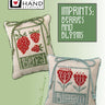 Two cross-stitched pillows with red berries and hearts on a light green background, featuring the Heart in Hand Needleworks logo.