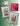 Two embroidered Christmas-themed pillows with 'Heart in Hand' branding on a green background.