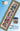 Cross-stitched design of a town with a small container on a blue background, featuring 'Heart of a Hand' branding.