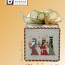 Cross-stitched nativity scene on a box with 'Heart in Hand Needleart' branding.